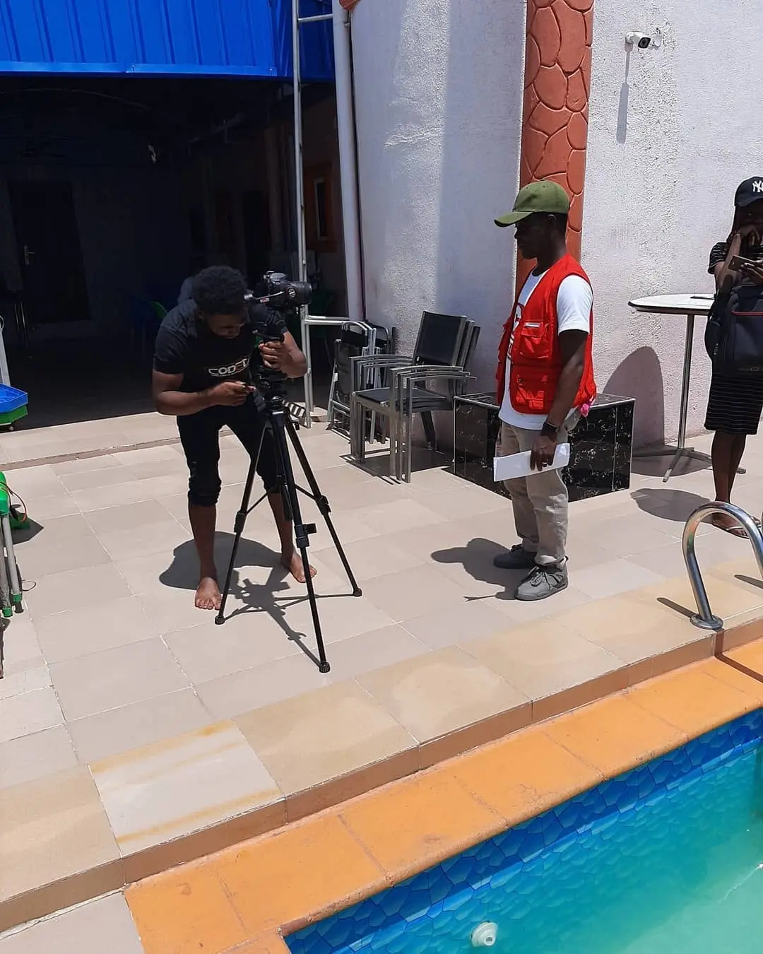 Taiwo Peace Oyeniyi filming with professional equipment