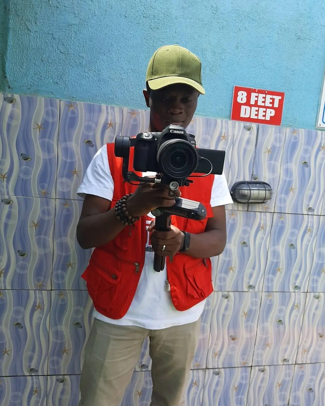Taiwo Peace Oyeniyi directing an outdoor production