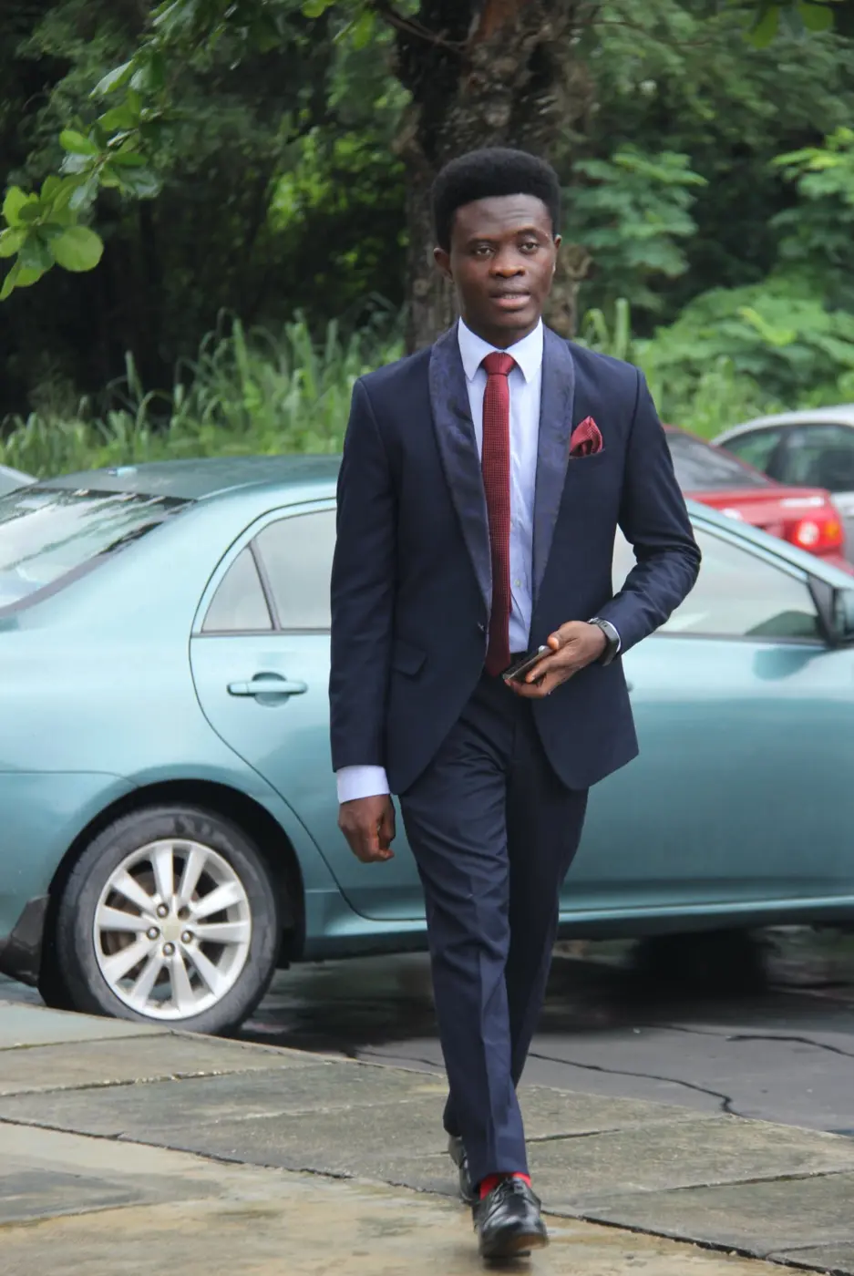 Taiwo Peace Oyeniyi in an outdoor executive portrait