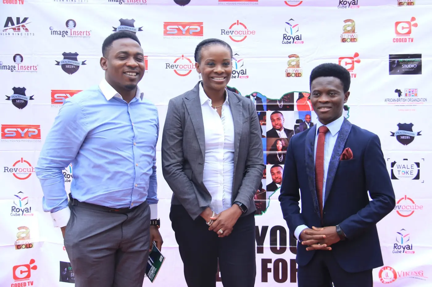 Taiwo Peace Oyeniyi with young professionals at an event